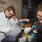 Three people making liquid nitrogen ice cream.