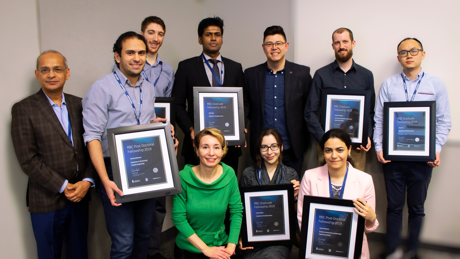 Eirene Seiradaki and the RBC Borealis Fellowship Candidates receiving a certificate.