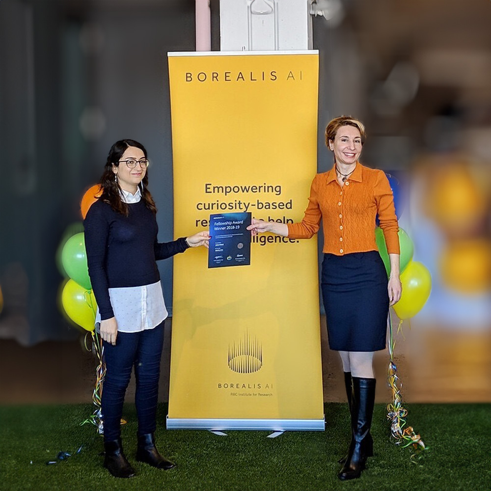 Eirene Seiradaki and a RBC Borealis Fellowship Candidate receiving a certificate.