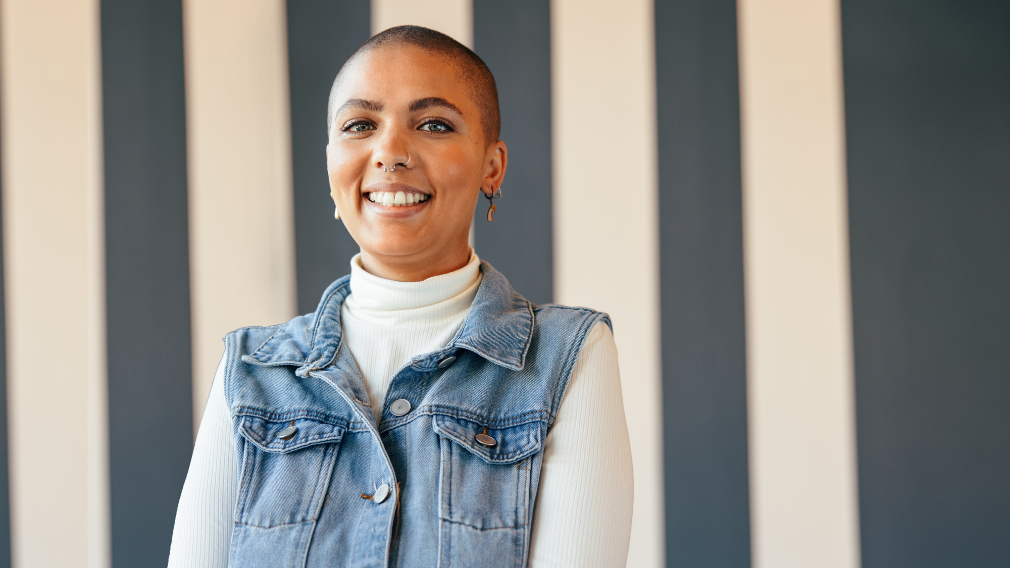 A young woman smiling at the camera.