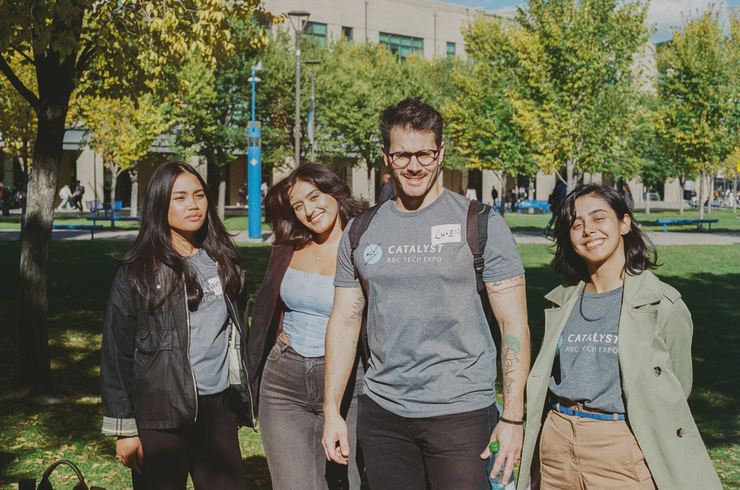 Four RBC Borealis employees standing outside of the university of Calgary. 